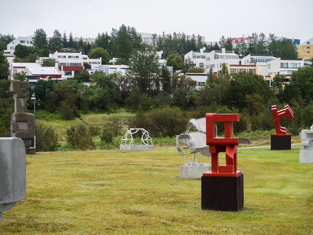 Sculptures and the neighborhood behind them